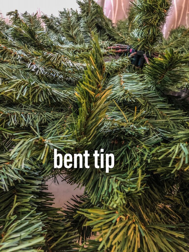 example of a bent tip on an artificial Christmas tree branch 